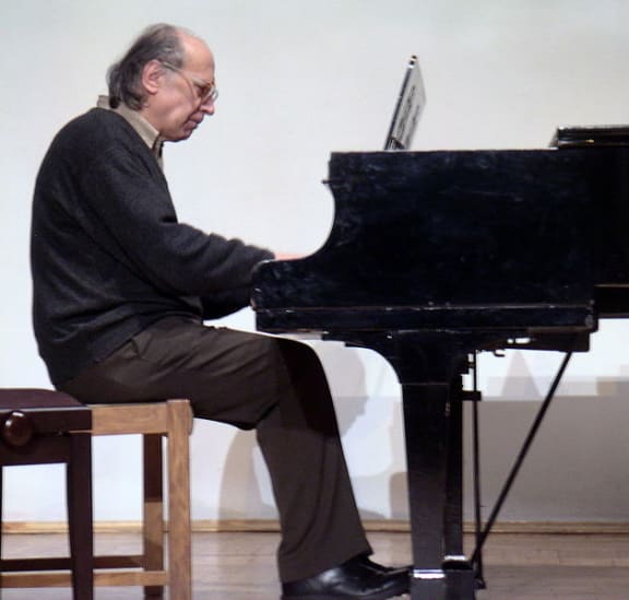 Ukrainian composer Valentin Silvestrov playing the piano