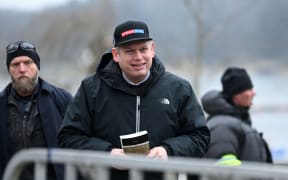 The leader of the far-right Danish political party Stram Kurs, Swedish-Danish politician Rasmus Paludan is pictured while holding an edition of The Quran while staging a protest outside the Turkish Embassy in Stockholm, Sweden, on January 21, 2023.