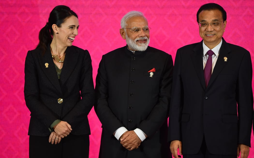 New Zealand's Prime Minister Jacinda Ardern (L) stands next to India's Prime Minister Narendra Modi (C) and China's Premier Li Keqiang during the RCEP summit in Bangkok on the sidelines of the ASEAN summit.