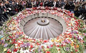 People lay flowers at the Tsitsernakaberd Memorial in Yerevan.