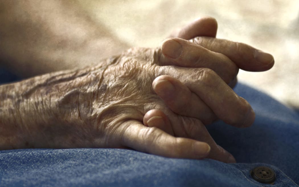 Old woman's hands clasped.