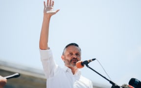 Green Party co-leader James Shaw responding to the demands from School Strike 4 Climate outside parliament on 26 January, 2021.