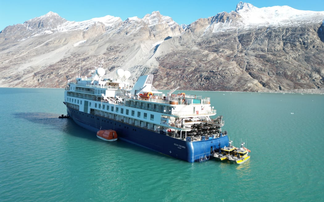 The cruise ship Ocean Explorer, operated by Australian company Aurora Expeditions, has been stuck in Alpefjord off Greenland's remote east coast since it ran aground on 11 September, 2023.