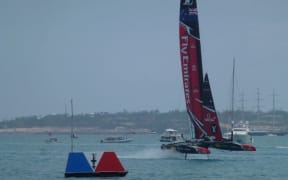 Emirates Team New Zealand crosses the finish line 29 seconds after Oracle Team USA in their final race of the America's Cup qualifiers.