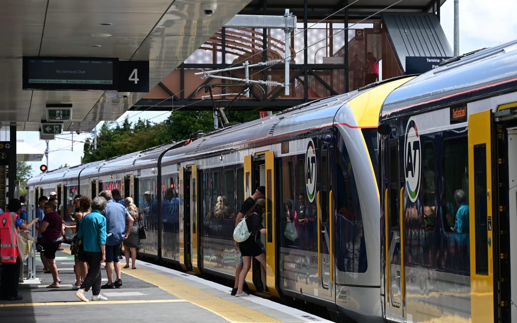 An electric train pulls into Pukekohe Station.
