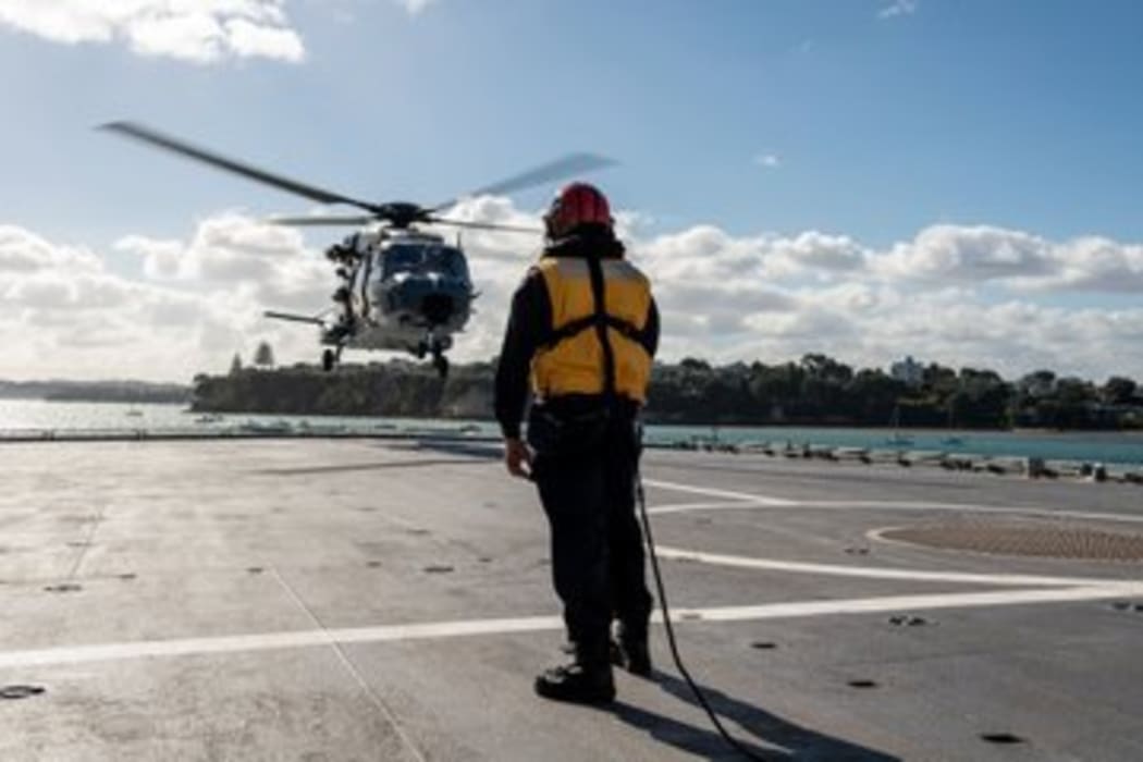 A NH90 helicopter lands onboard the HMNZS Canterbury.