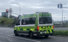 A St John ambulance with messages of strike action written on the windows