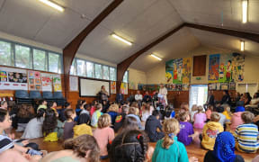 Associate Education Minister Jan Tinetti among a group of school children.