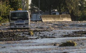 The morning after the town of Edgecumbe was flooded by a burst stopbank.  The displaced wall that was supposed to prevent the river Rangitaiki from flooding the town sits in the middle of College Road.  Friday 7 April 2017