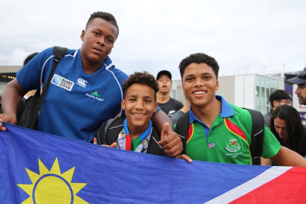 Kauaa Katjirua (l), Levalle Underhell (r) and friend at the New Zealand v Namibia game at Tokyo Stadium on Sunday