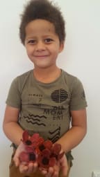 Jackson Nwankwo, 5, with poppies he made from egg cartons