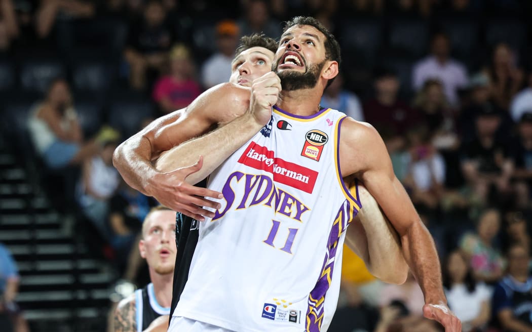 Sydney Kings centre Tim Soares and Breakers centre Rob Loe jostle for a rebound, 2026