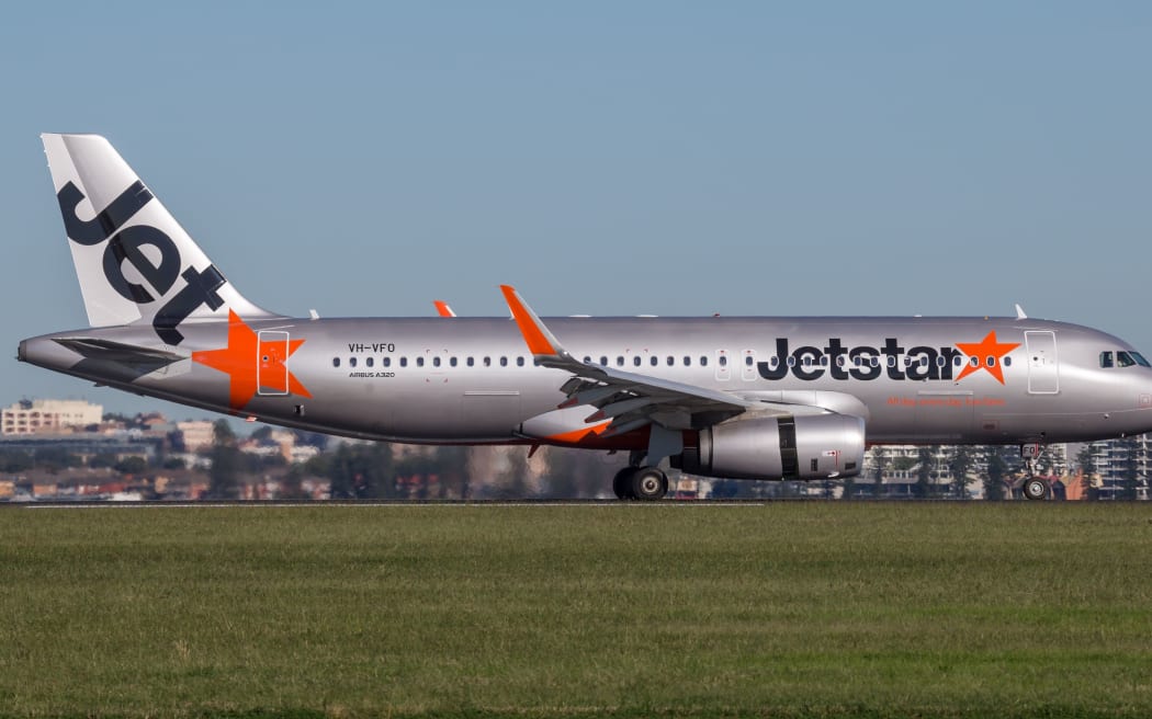 Sydney, Australia - May 5, 2014: Jetstar Airways Airbus A320 airliner landing at Sydney Airport.