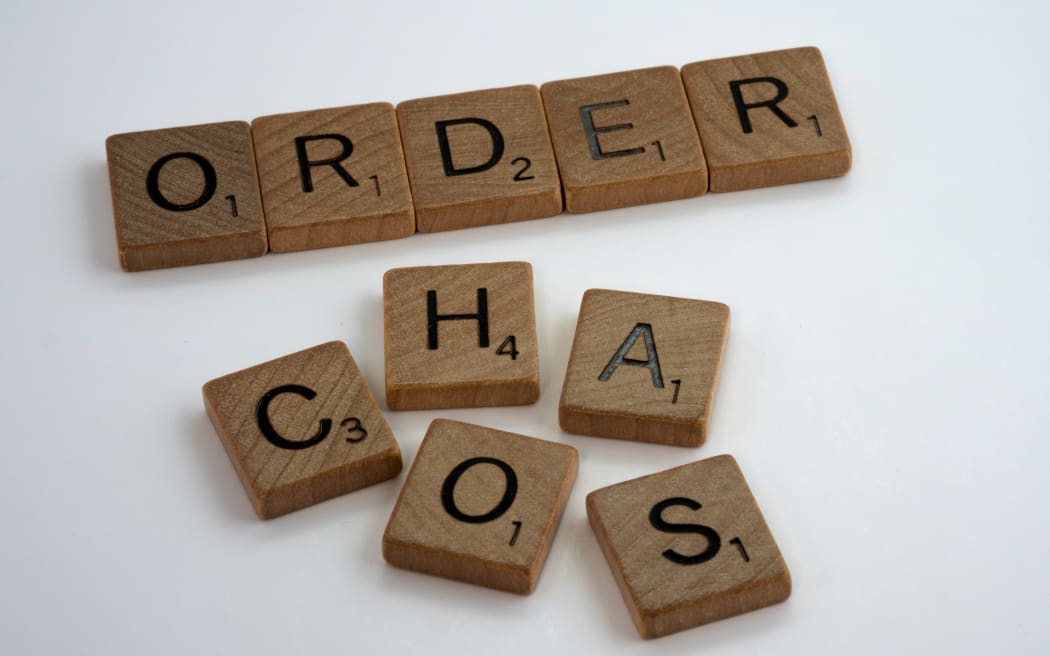 Scrabble tiles spelling out order and chaos
