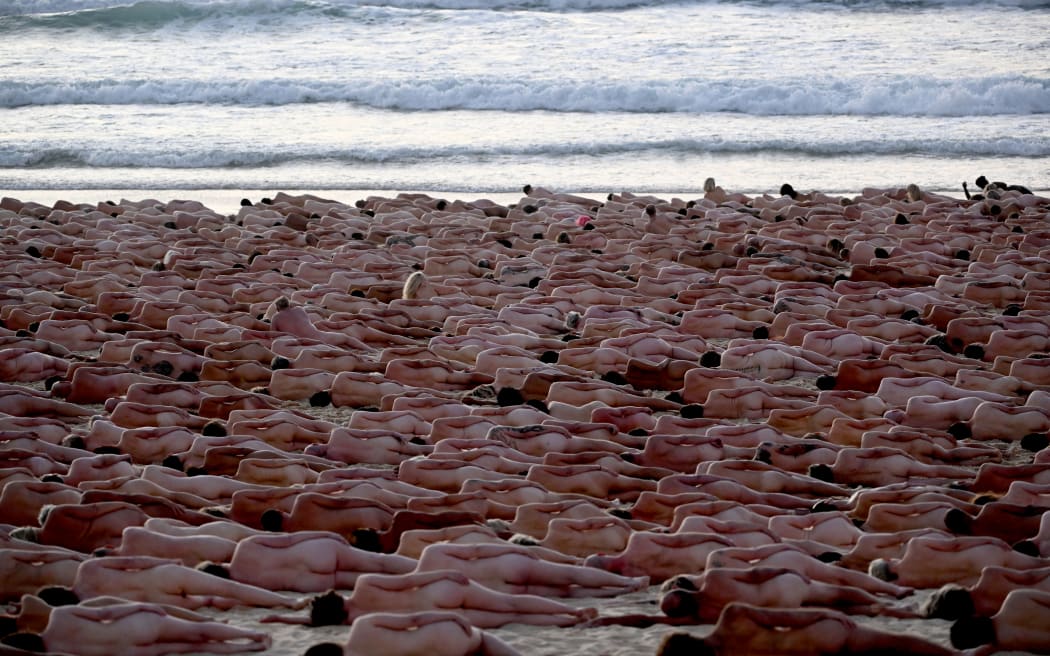 About 2500 people posed nude during sunrise on Sydney's Bondi Beach for US art photographer Spencer Tunick, to raise awareness for skin cancer on 26 November 2022.