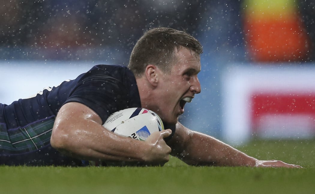 Scotland centre Mark Bennett scores his team's third try during a quarter-final match of the 2015 Rugby World Cup between Australia and Scotland at Twickenham, London on October 18, 2015. AFP PHOTO / ADRIAN DENNIS