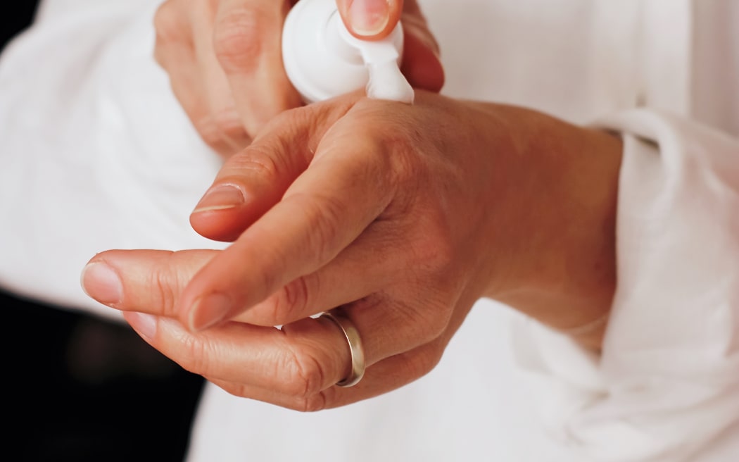 Person applying hand cream