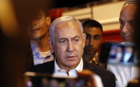 Israeli Prime Minister Benjamin Netanyahu tours the city of Lod early on 12May.