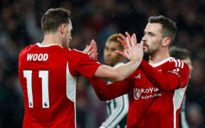 Chris Wood of Nottingham Forest (L) celebrates a win.