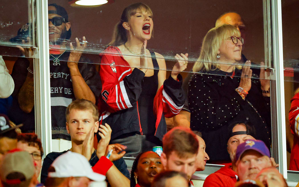 KANSAS CITY, MISSOURI - OCTOBER 12: Taylor Swift and Donna Kelce applaud before the game between the Kansas City Chiefs and the Denver Broncos at GEHA Field at Arrowhead Stadium on October 12, 2023 in Kansas City, Missouri. (Photo by David Eulitt/Getty Images)