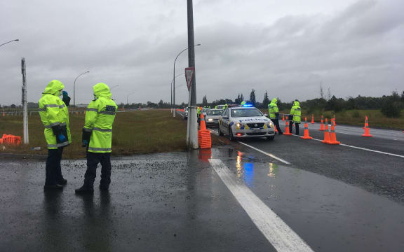 At a police checkpoint on SH1 south of Auckland, there are no queues at all coming into the region as it moves to alert level 3 on 15 January, 2021.