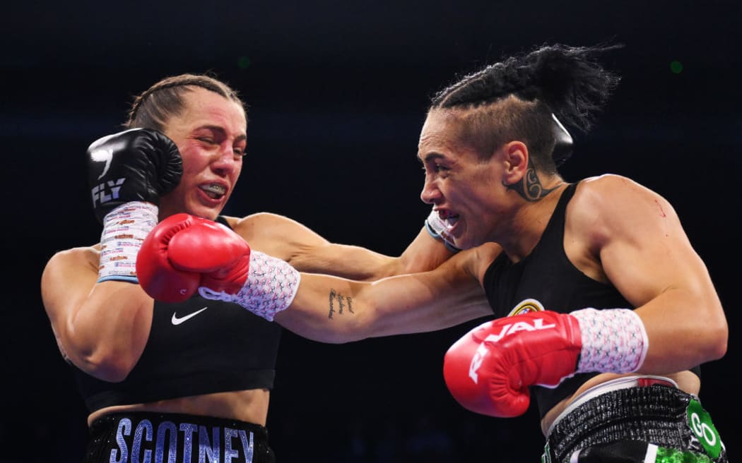 Ellie Scotney and Mea Motu exchange punches during the Women's IBF, IBO and WBO World Super Bantamweight titles' fight.