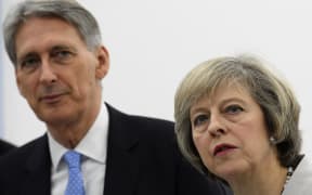 British Chancellor Philip Hammond and Prime Minister Theresa May