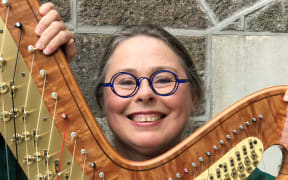 Harpist Helen Webby with harp