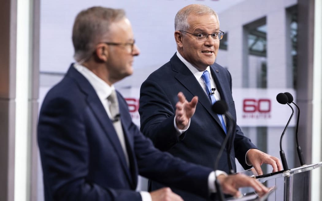 Australian Prime Minister Scott Morrison (R) and the Opposition Leader Anthony Albanese attend the second leaders' debate of the 2022 federal election campaign.