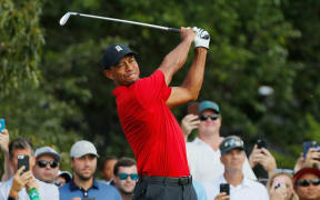 Tiger Woods plays his shot from the third tee during the final round of the Tour Championship in Atlanta, Georgia.