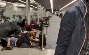 More than 100 passengers transiting through Auckland Airport were forced to wait in a cold corridor overnight  on 2 September, 2022.