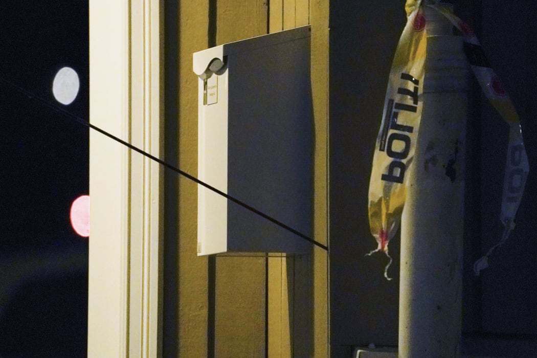An arrow is left in a wall at the scene where a man armed with bow killed members of the public before he was arrested by police in Kongsberg.