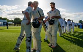 Kane Williamson celebrates with Tom Latham and Colin De Grandhomme on winning the test series during the 4th day of the second International Cricket Test match, V Bangladesh, Hagley Oval, Christchurch, 23th January 2017.