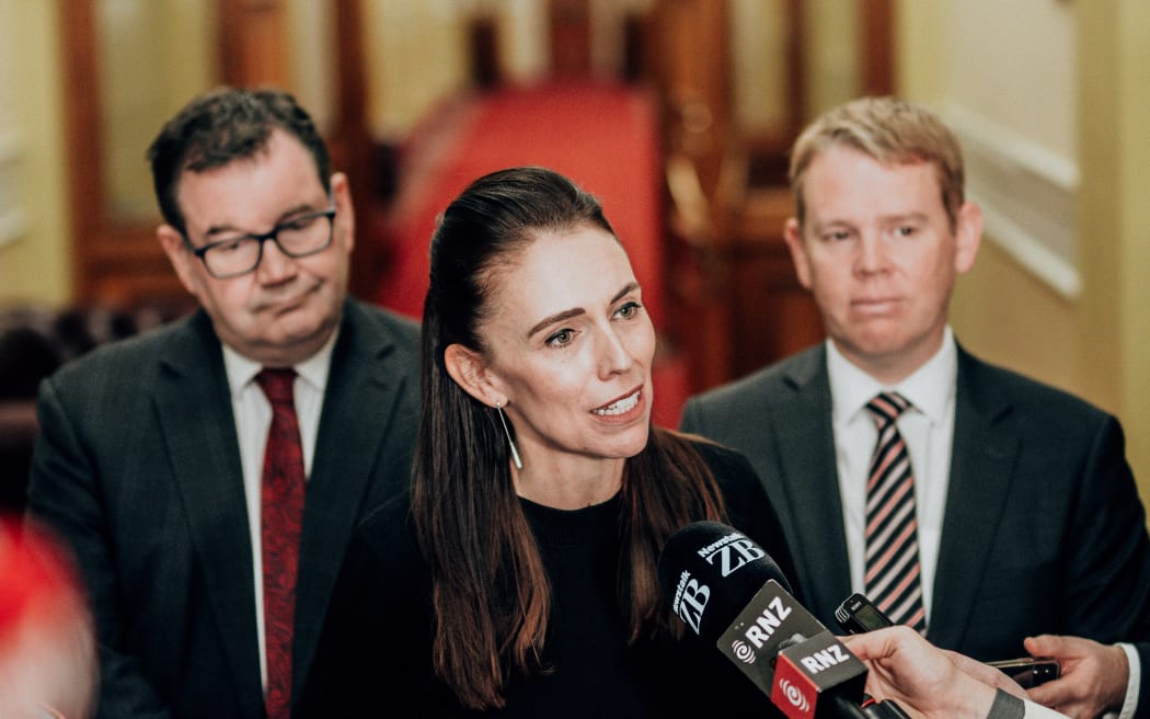 Jacinda Ardern flanked by Grant Robertson, left, and Chris Hipkins, right.