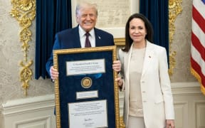 Venezuela's Opposition leader María Corina Machado and President of the United States Donald Trump after Machado presented her Nobel prize to him.