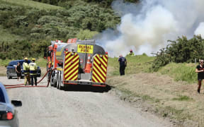Firefighters battle a blaze in Millwater, Auckland, on 7 November 2025.