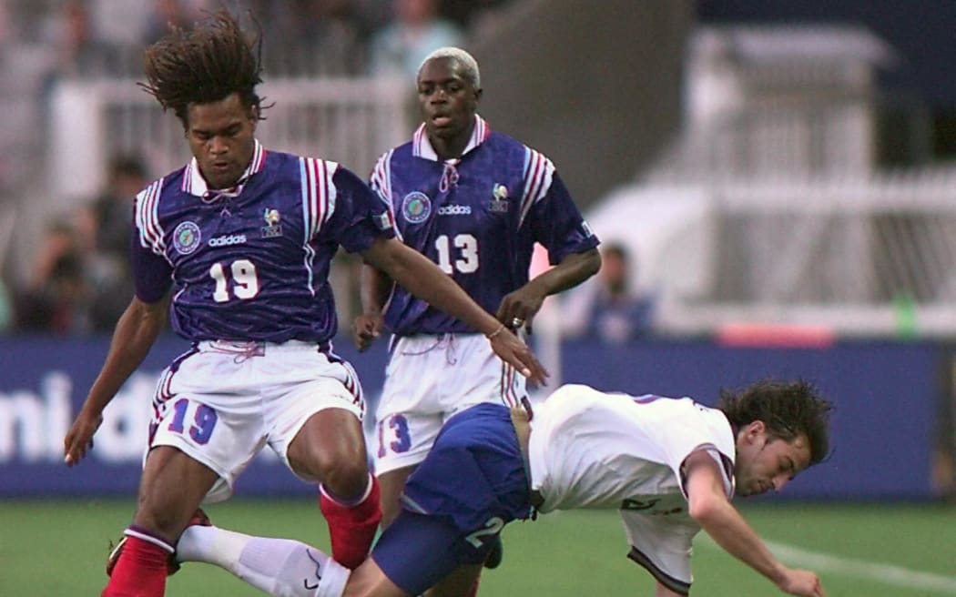 Christian Karembeu tussle with Italian Alessandro del Piero in Paris.