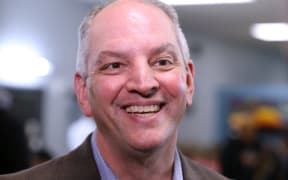 Governor John Bel Edwards talks to media at the Case Closed Barbershop on November 15, 2019 in New Orleans, Louisiana.