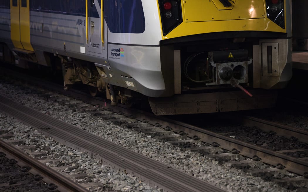 A train sits waiting to depart at Britomart