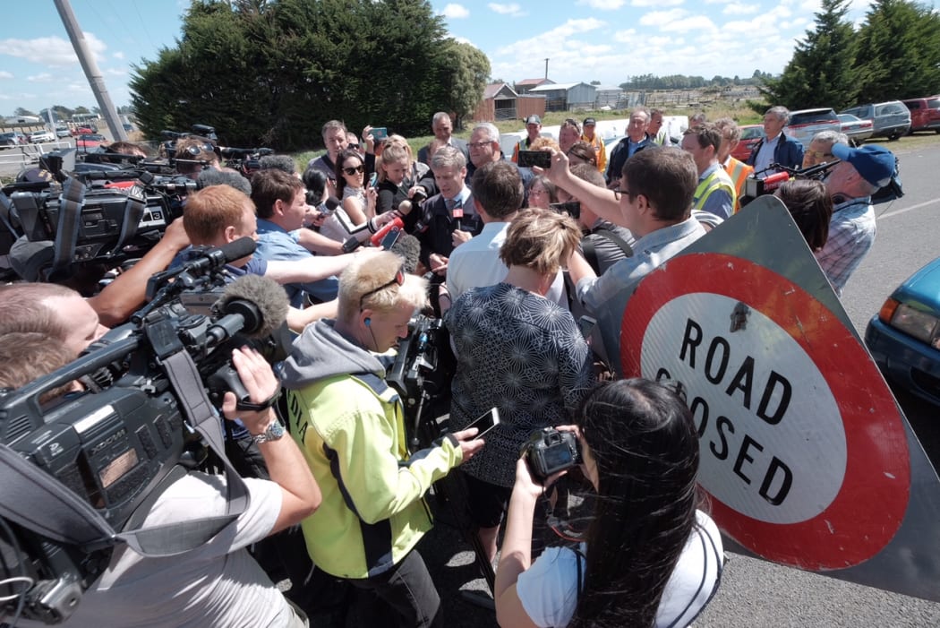 Media surrounds Prime Minister Bill English