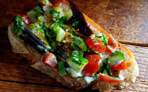 Eggplant with cucumber and tomato salad by Julie Biuso.
