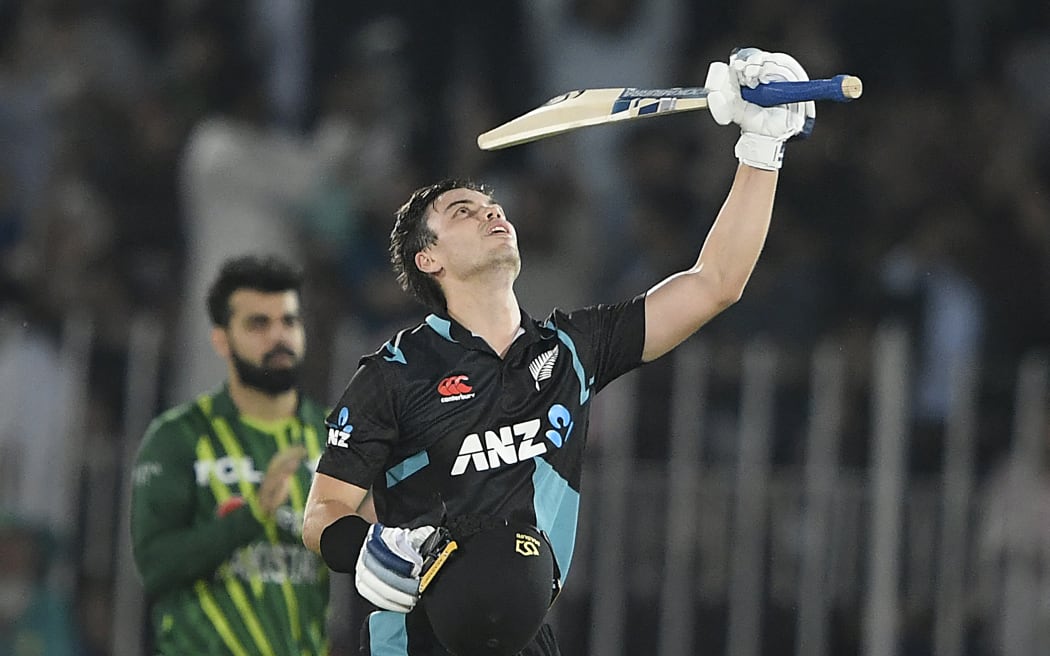New Zealand's Mark Chapman celebrates after scoring a century during the fifth and final Twenty20 international cricket match between Pakistan and New Zealand at the Rawalpindi Cricket Stadium, 2023.