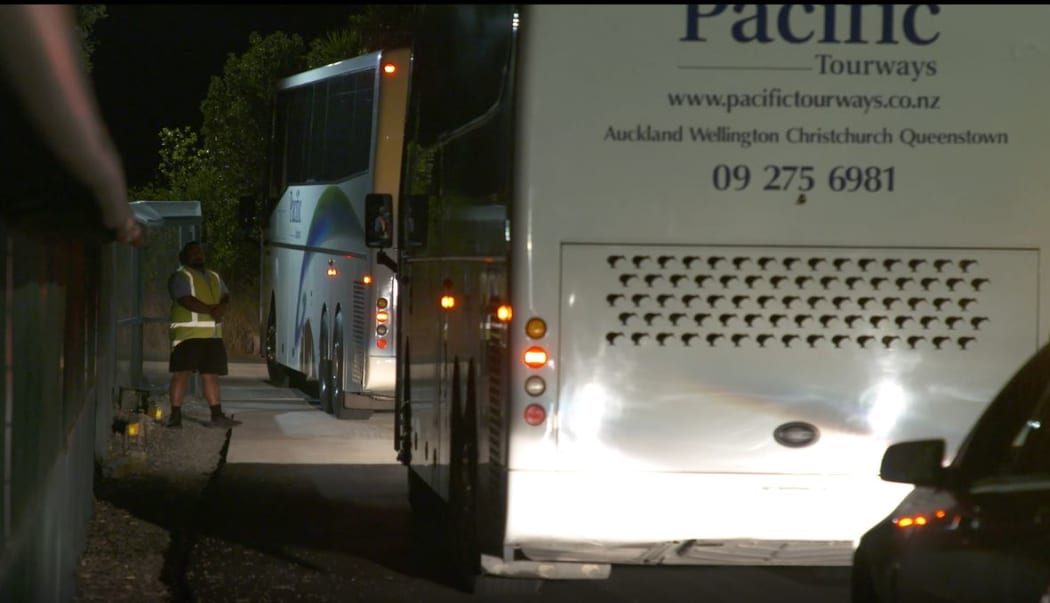 Buses arrived at Whangaparaoa carrying New Zealanders from Wuhan.