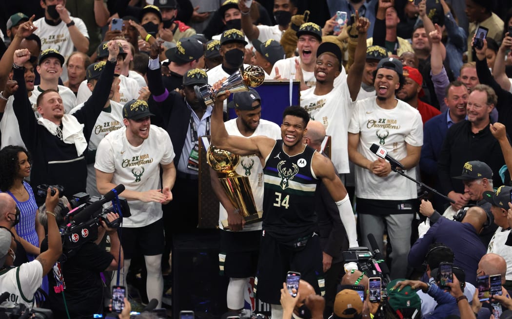 Giannis Antetokounmpo #34 of the Milwaukee Bucks celebrates winning the Bill Russell NBA Finals MVP Award after defeating the Phoenix Suns in Game Six to win the 2021 NBA Finals on July 20, 2021 in Milwaukee, Wisconsin.