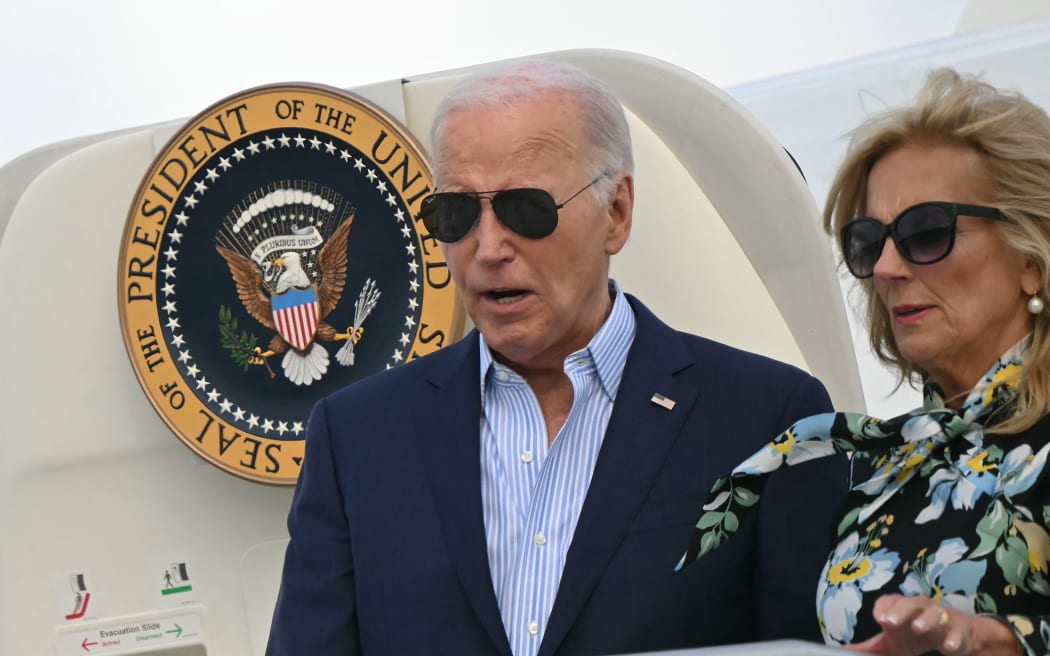 US President Joe Biden and First Lady Jill Biden arrive at McGuire Air Force Base in New Jersey on 29 June ahead of campaign fundraisers. (Photo by Mandel NGAN / AFP)