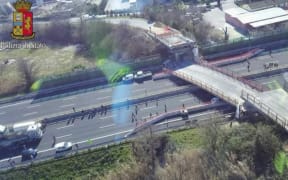 A motorway bridge has collapsed near the north-east Italian city of Ancona, killing two.