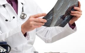 Doctor is making a diagnosis for a patient in medical office