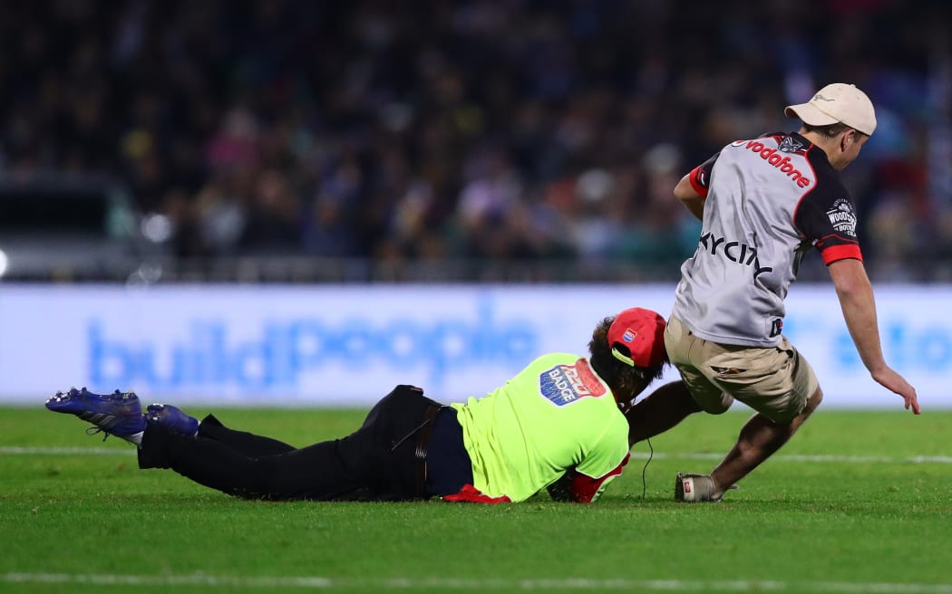 Pitch invaders during the NRL round 13 match between the New Zealand Warriors and the Brisbane Broncos at McLean Park in Napier, New Zealand on Saturday May 27, 2023. Copyright photo: Aaron Gillions / www.photosport.nz