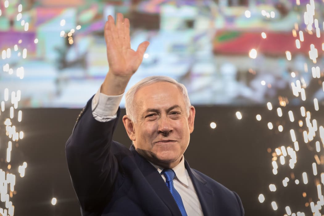10 April 2019, Israel, Tel Aviv: Benjamin Netanyahu, Prime Minister of Israel, beckons supporters after the polling stations have been closed. Several hours after the closure of the polling stations in Israel, only partial results were available on the night of Wednesday.