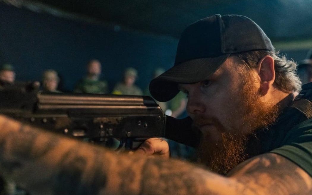 A man holding a gun.